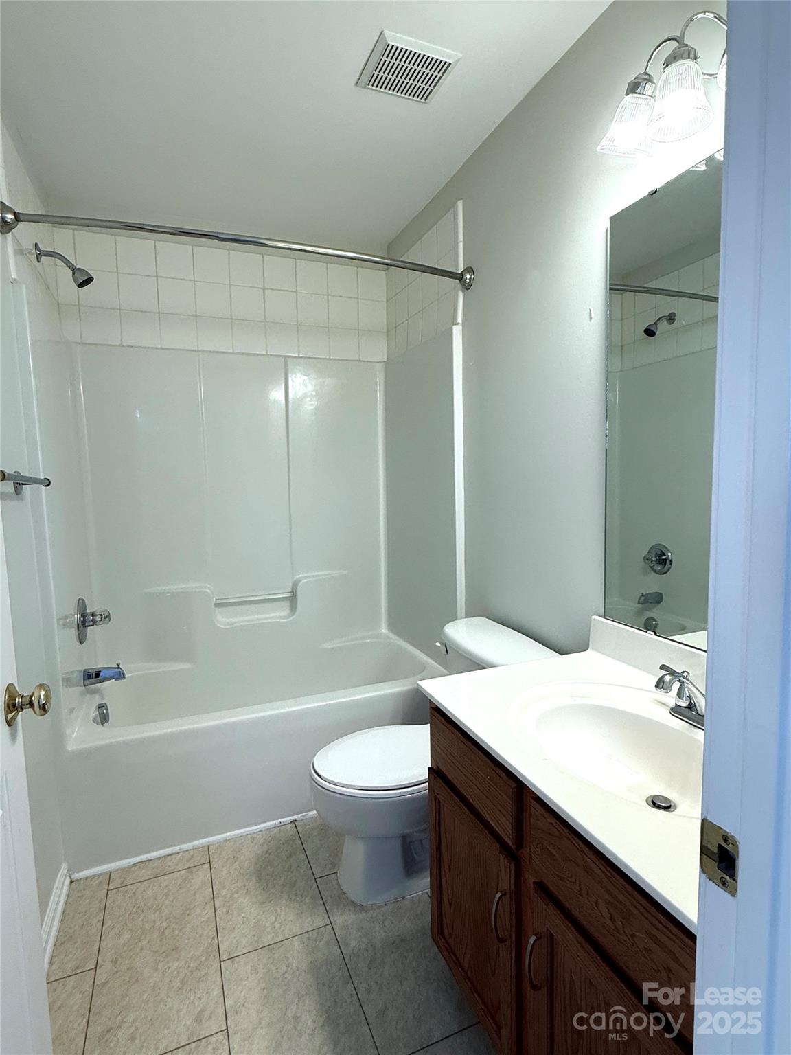 7549 Bluff Point Lane Denver, NC 28037 - Photo 14 of 18 a bathroom with a sink a toilet and shower