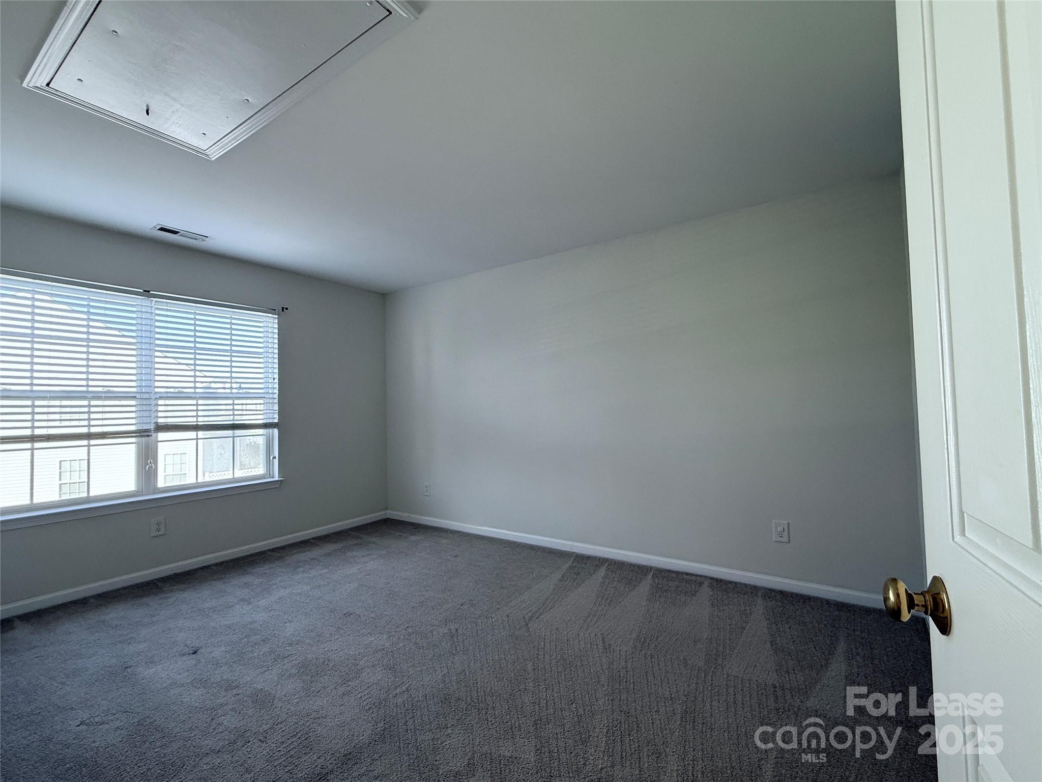 7549 Bluff Point Lane Denver, NC 28037 - Photo 16 of 18 an empty room with a window