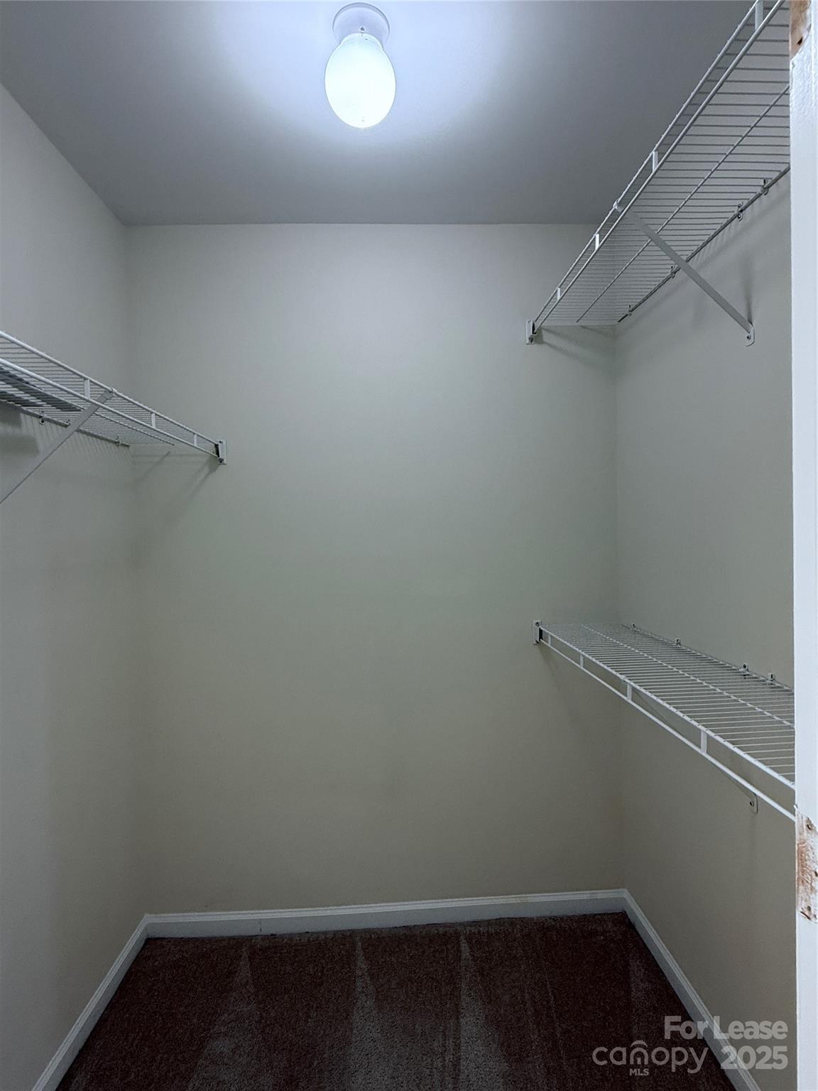 7549 Bluff Point Lane Denver, NC 28037 - Photo 17 of 18 a view of a room with racks on the wall