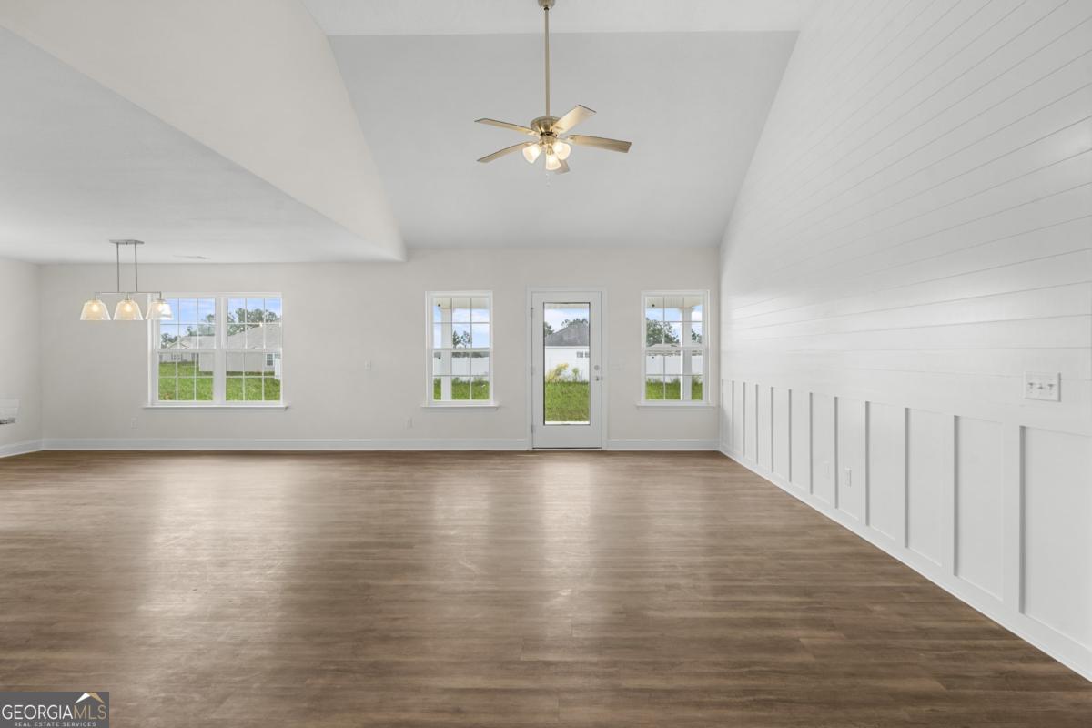 909 Ryegrass Road, Unit 81 Statesboro, GA 30458 - Photo 2 of 23 wooden floor in an empty room with a window