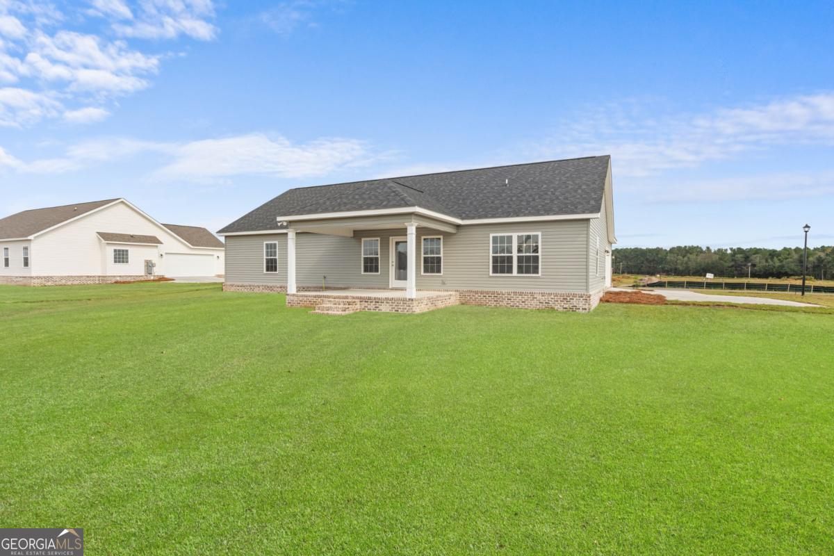 909 Ryegrass Road, Unit 81 Statesboro, GA 30458 - Photo 22 of 23 a view of a house with a big yard