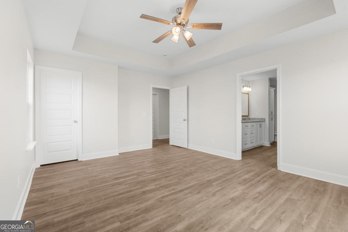 909 Ryegrass Road, Unit 81 Statesboro, GA 30458 - Photo 9 of 23 a view of empty room with wooden floor