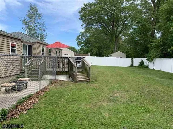 a view of a house with a yard porch and sitting area