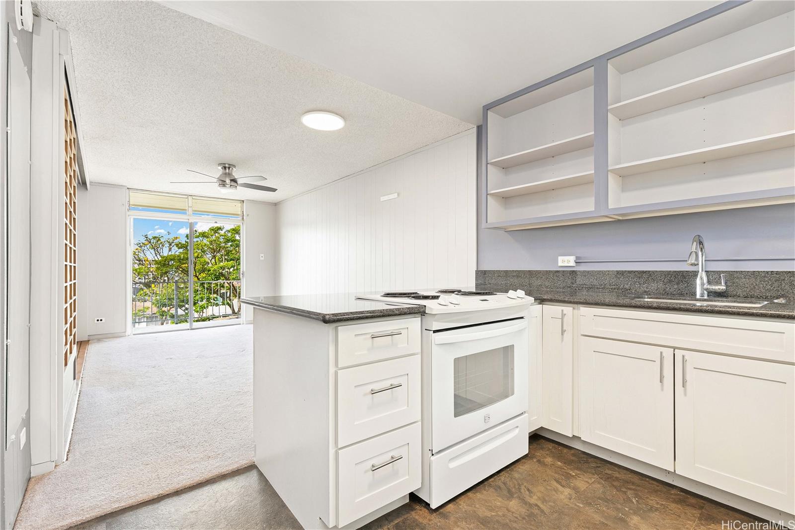 1002 A Prospect Street, Unit 14 Honolulu, HI 96813 - Photo 1 of 1 a kitchen with white cabinets and white appliances