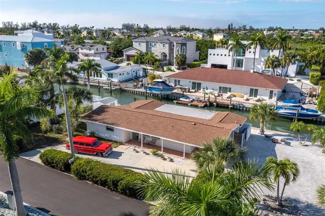 an aerial view of residential houses and outdoor space