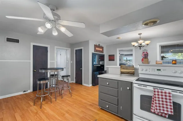 a view of a livingroom with furniture and wooden floor