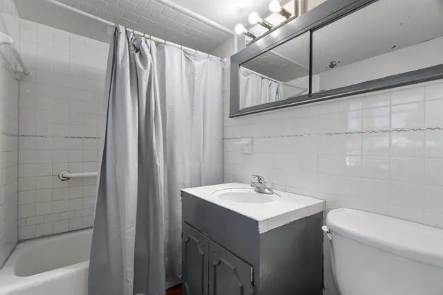 a view of a patio with table and chairs potted plants