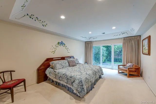 a bedroom with a bed and glass window