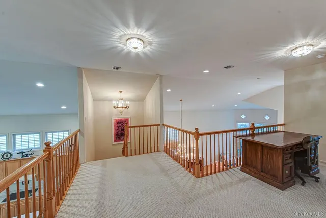 a view of a hallway with a chandelier