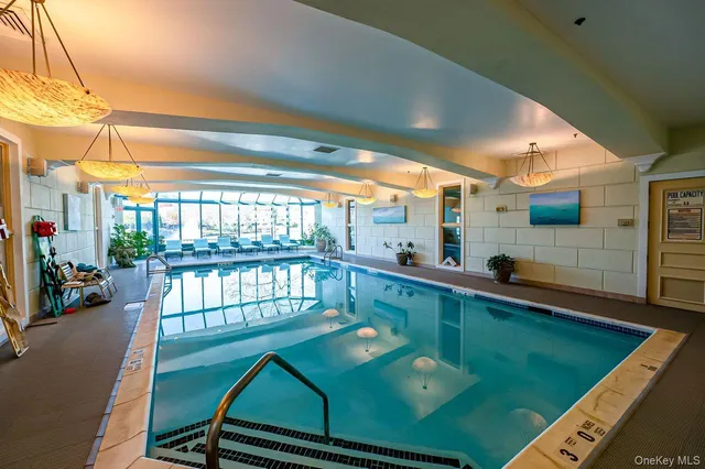 a view of a swimming pool with a patio