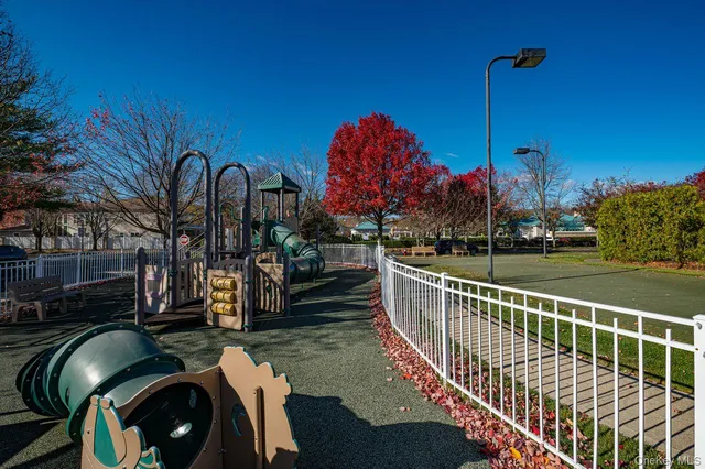a view of a balcony with iron fence