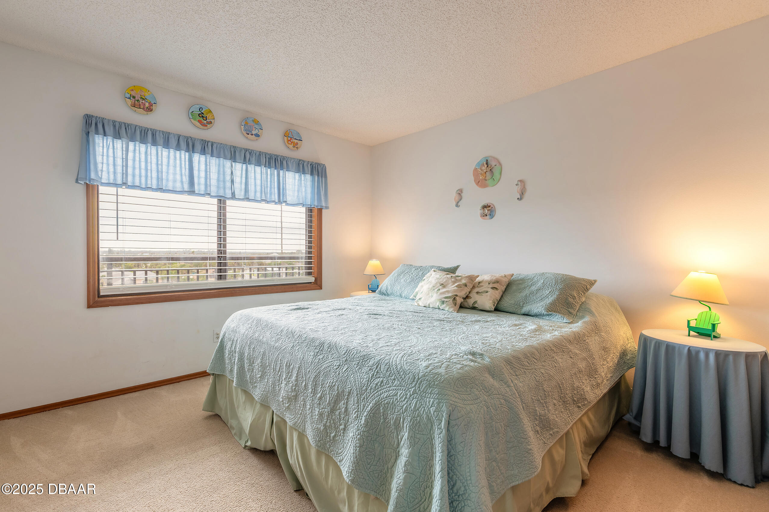 2222 Ocean Shore Boulevard, Unit 402B Ormond Beach, FL 32176 - Photo 18 of 31 a bedroom with a bed and a window