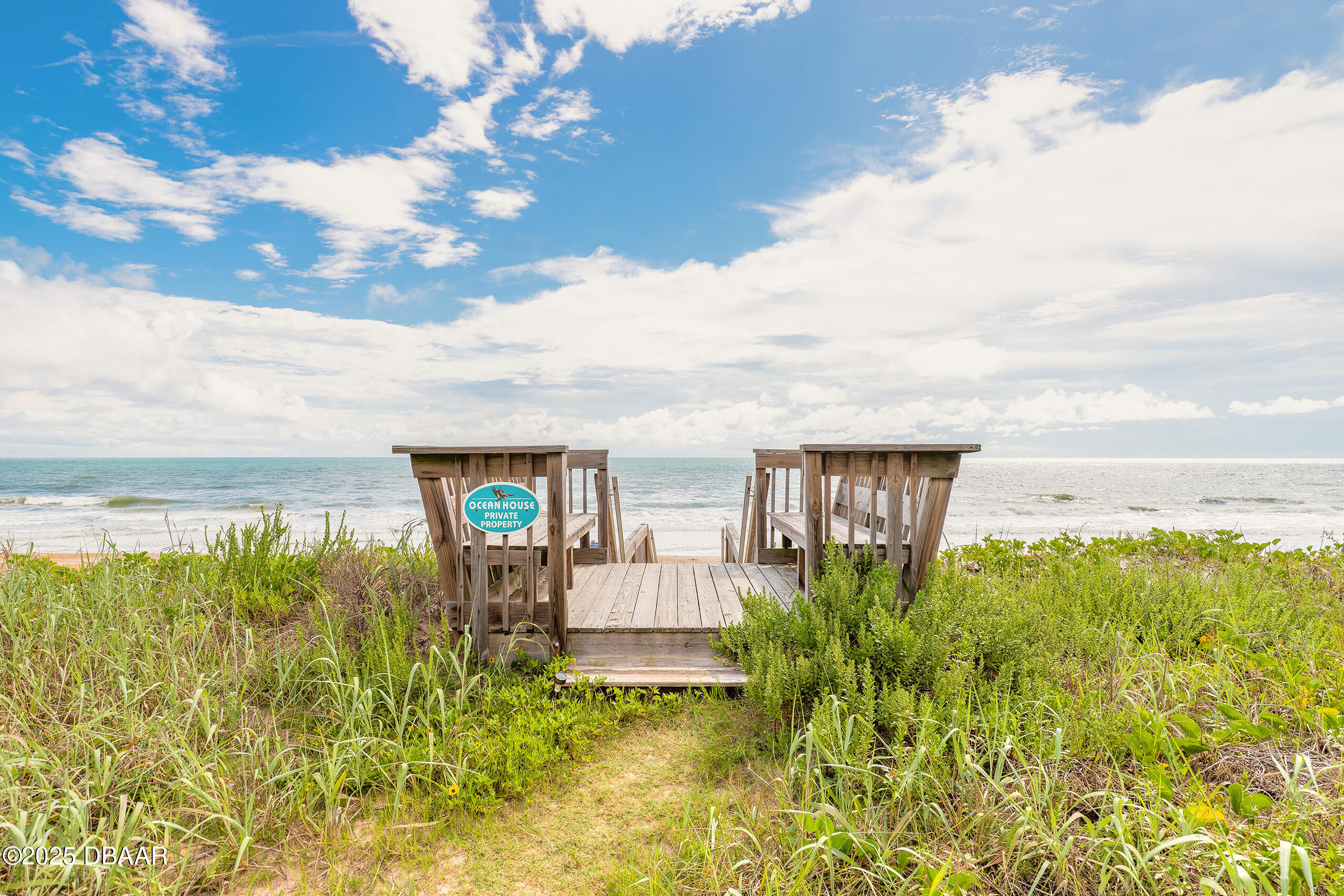 2222 Ocean Shore Boulevard, Unit 402B Ormond Beach, FL 32176 - Photo 2 of 31 a view of a garden with lawn chairs