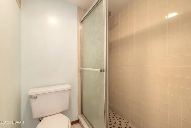 a bedroom with furniture and a flat screen tv