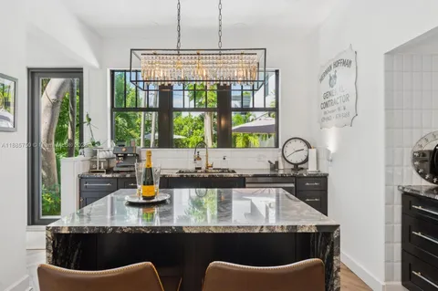 a kitchen with a table chairs stove and cabinets
