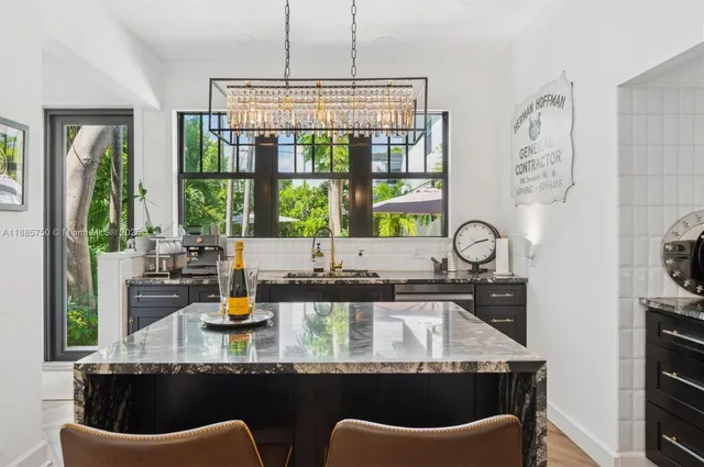 a kitchen with a table chairs stove and cabinets