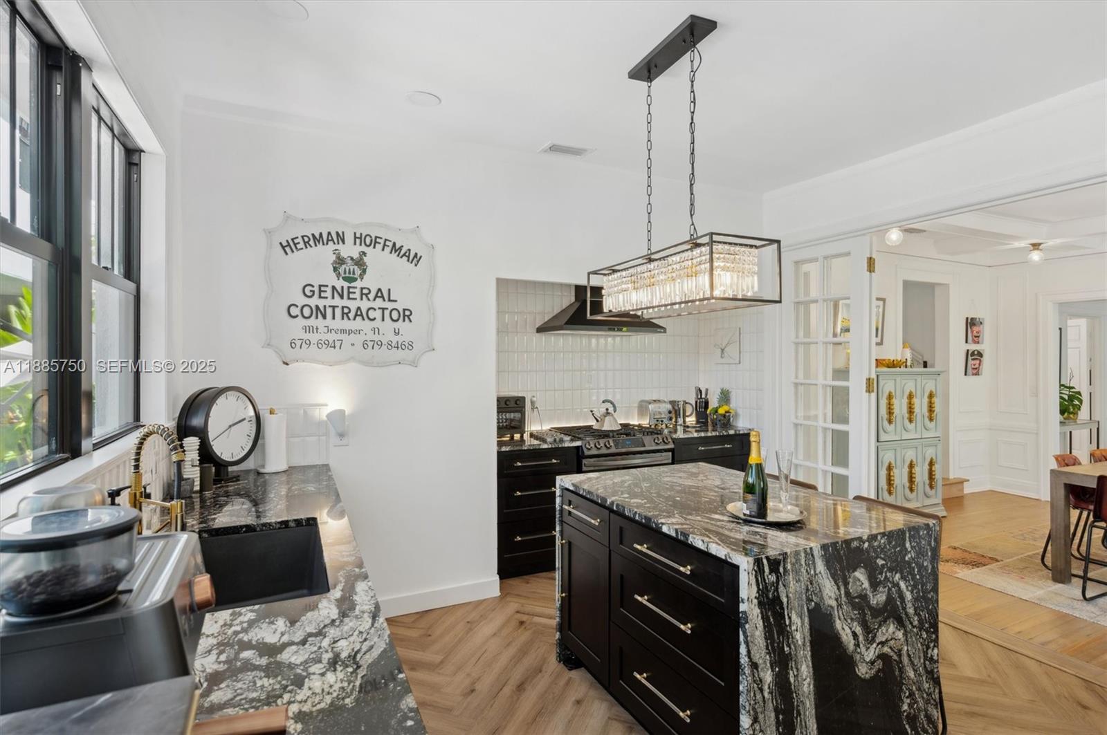 135 Northeast 45th Street Miami, FL 33137 - Photo 17 of 48 a kitchen with stainless steel appliances granite countertop a stove a sink and a refrigerator