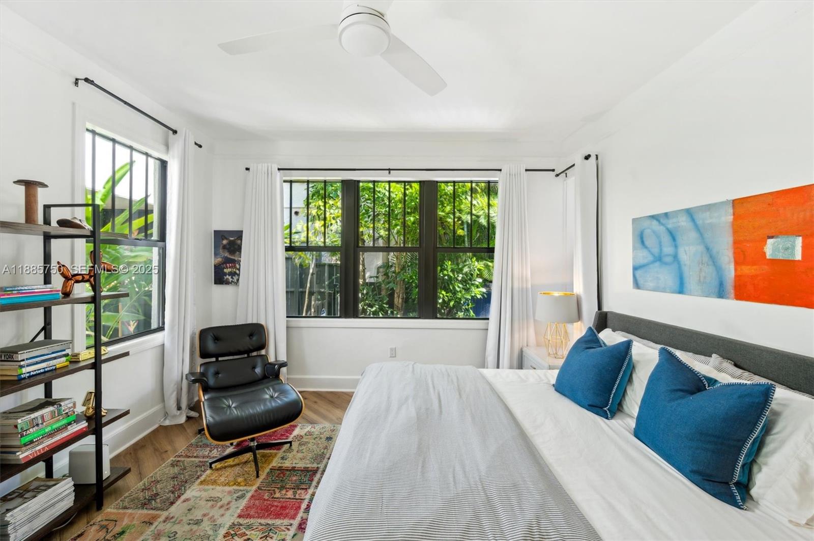 135 Northeast 45th Street Miami, FL 33137 - Photo 20 of 48 a living room with furniture and a floor to ceiling window