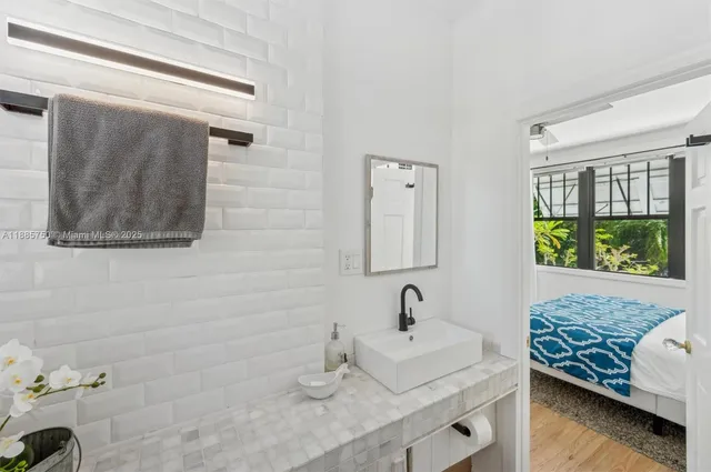 a bathroom with a sink and a mirror