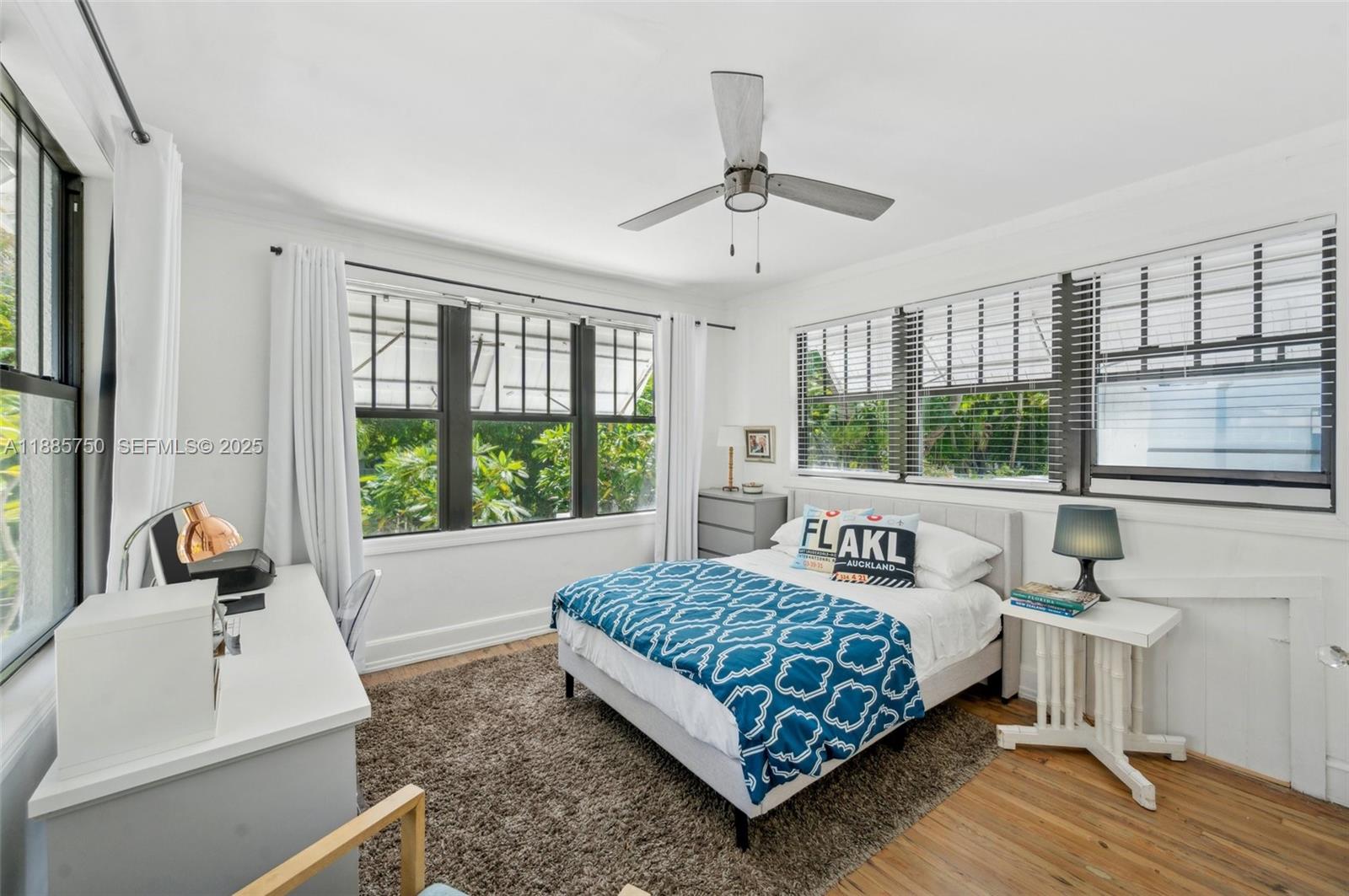 135 Northeast 45th Street Miami, FL 33137 - Photo 27 of 48 a bedroom with a bed and a large window