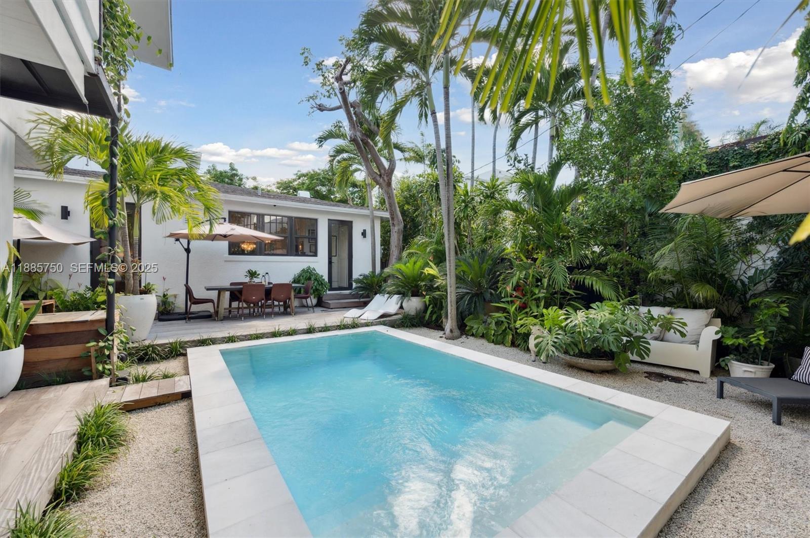 135 Northeast 45th Street Miami, FL 33137 - Photo 30 of 48 a view of a house with swimming pool and sitting area