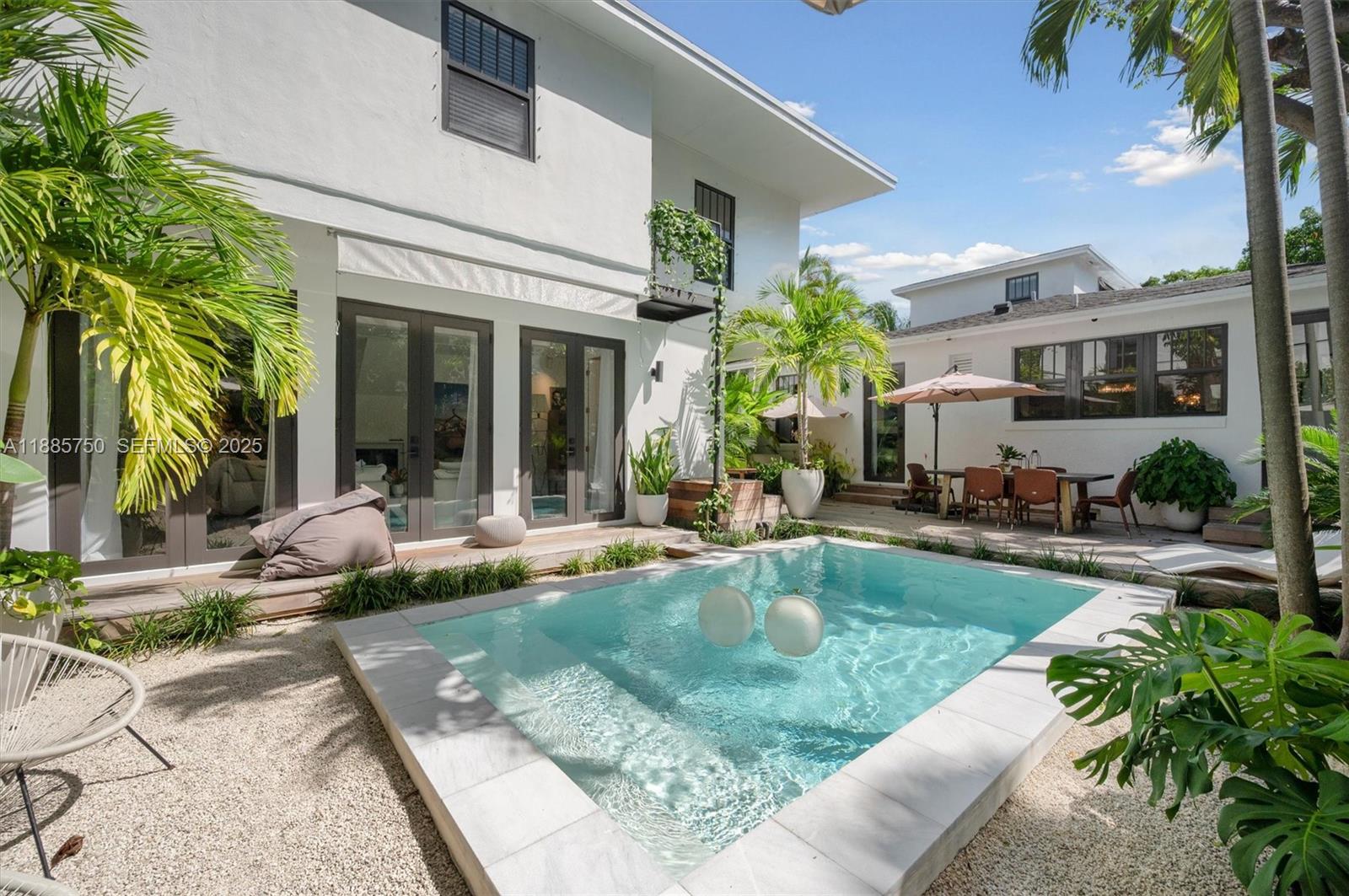 135 Northeast 45th Street Miami, FL 33137 - Photo 32 of 48 a view of a house with backyard and sitting area