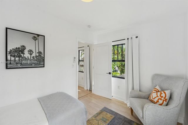 a bedroom with a bed and a couch