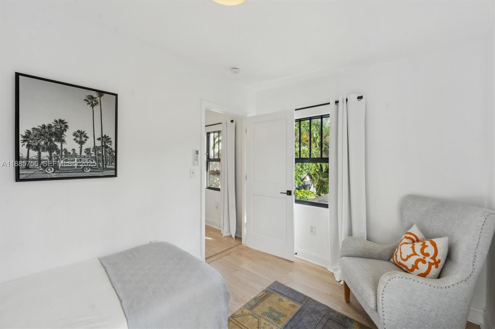 135 Northeast 45th Street Miami, FL 33137 - Photo 40 of 48 a bedroom with a bed and a couch