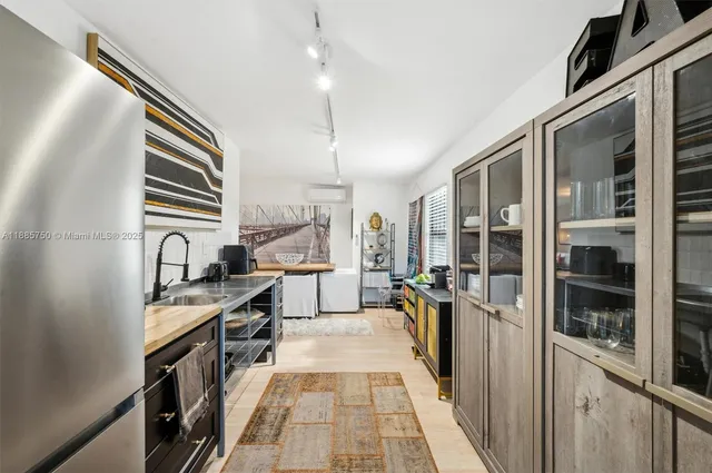 a kitchen with stainless steel appliances granite countertop lots of counter space and cabinets