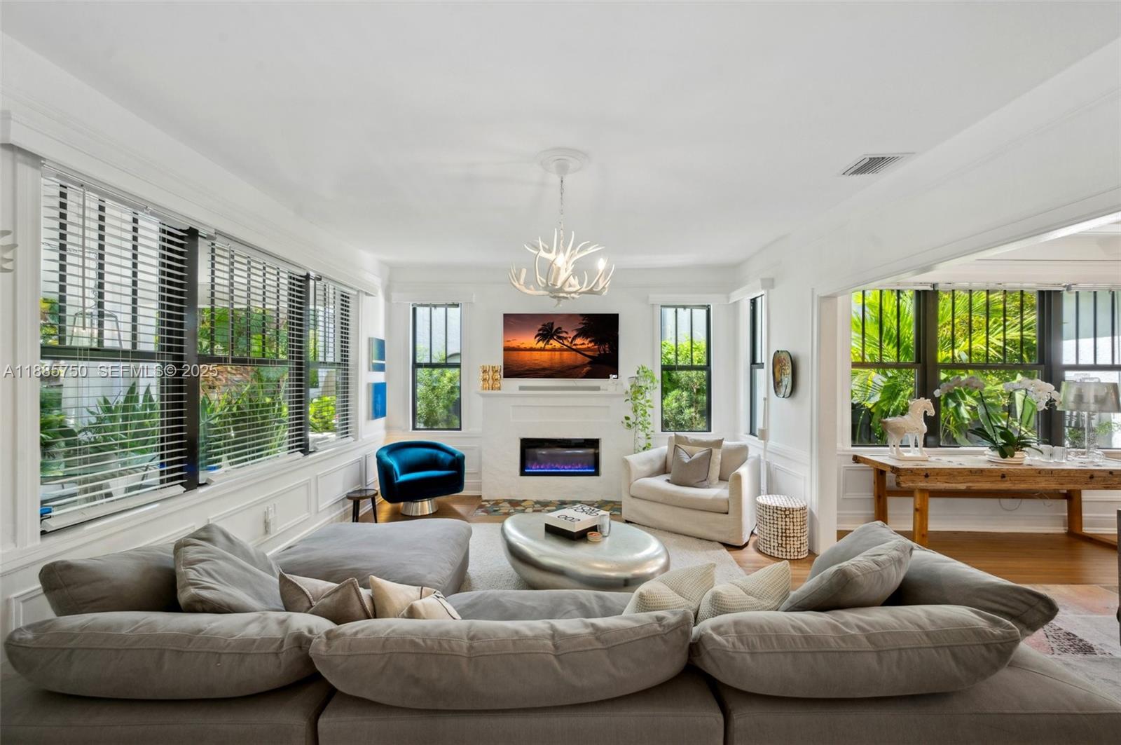 135 Northeast 45th Street Miami, FL 33137 - Photo 7 of 48 a living room with fireplace furniture and a large window