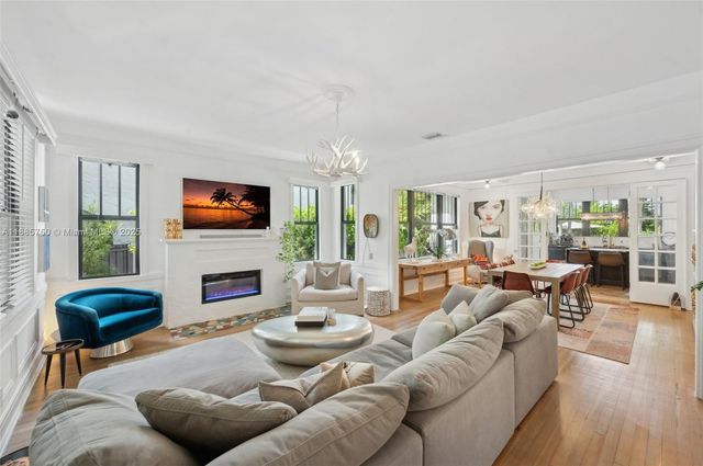 a living room with furniture fireplace and a flat screen tv