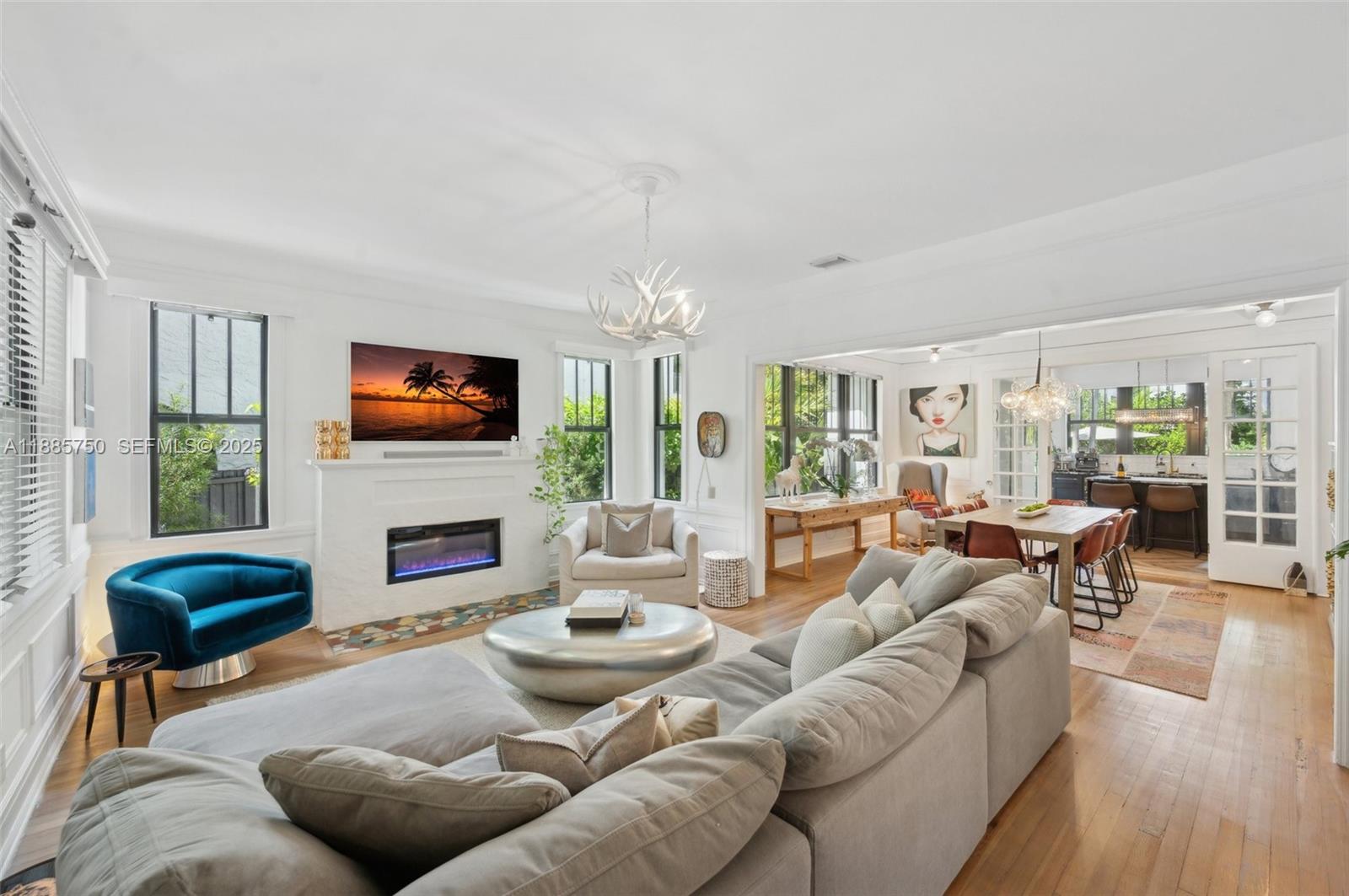 135 Northeast 45th Street Miami, FL 33137 - Photo 8 of 48 a living room with furniture fireplace and a flat screen tv
