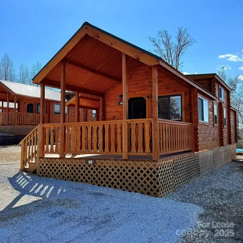 a view of a house with wooden deck