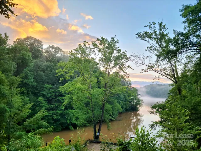 a view of a lake with top of house