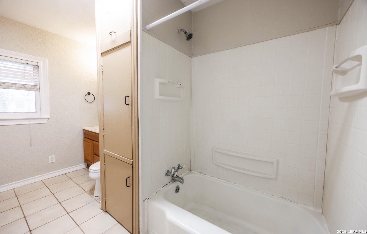 149 South Carroll Street Poth, TX 78147 - Photo 19 of 28 a bathroom with a tub and shower