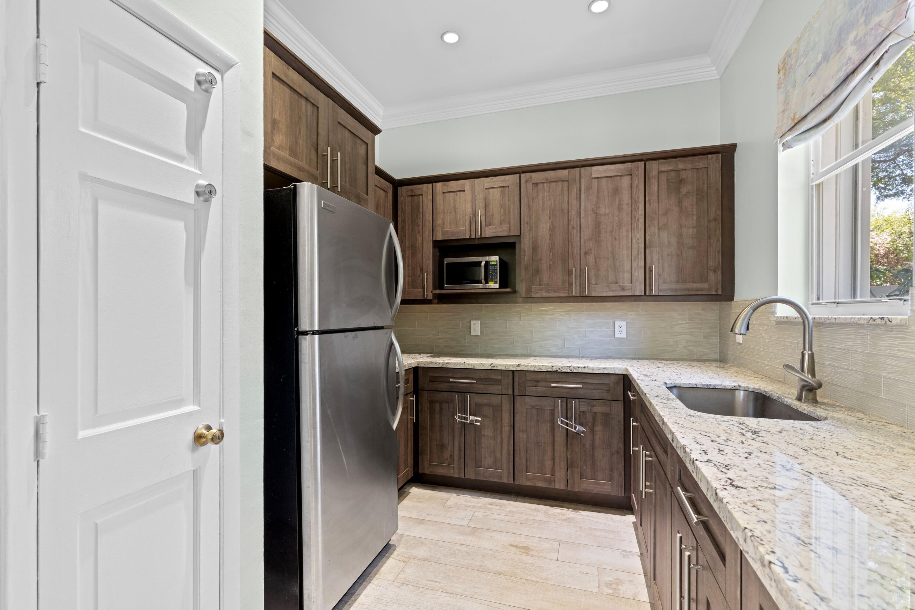 18037 Mambo Drive Boca Raton, FL 33496 - Photo 41 of 56 Symphony Bay Common Kitchen