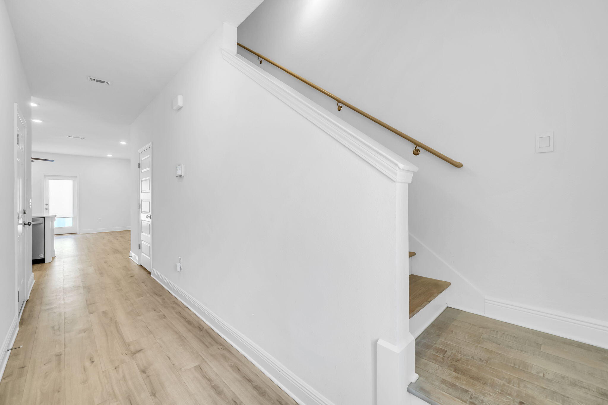 22 Redbird Loop Destin, FL 32541 - Photo 22 of 40 a view of a hallway with wooden floor