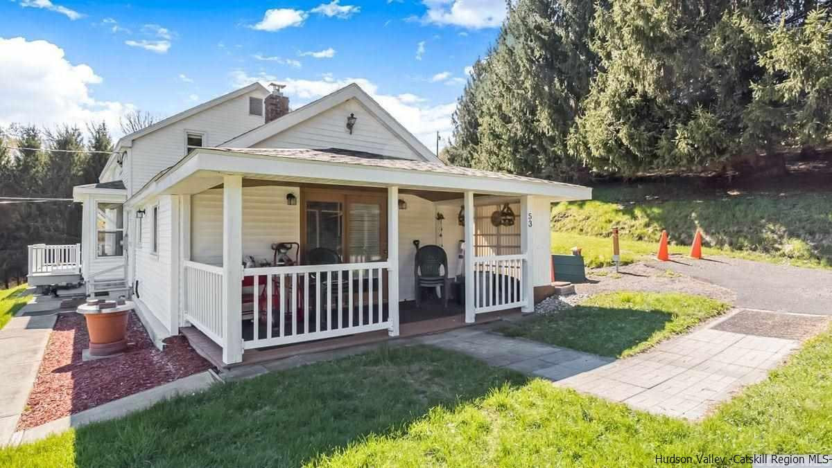 53 Pine Valley Road Greenville, NY 12083 - Photo 15 of 35 a front view of a house with garden