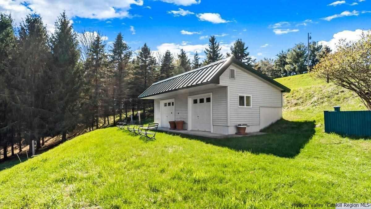 53 Pine Valley Road Greenville, NY 12083 - Photo 16 of 35 a backyard of a house with table and chairs