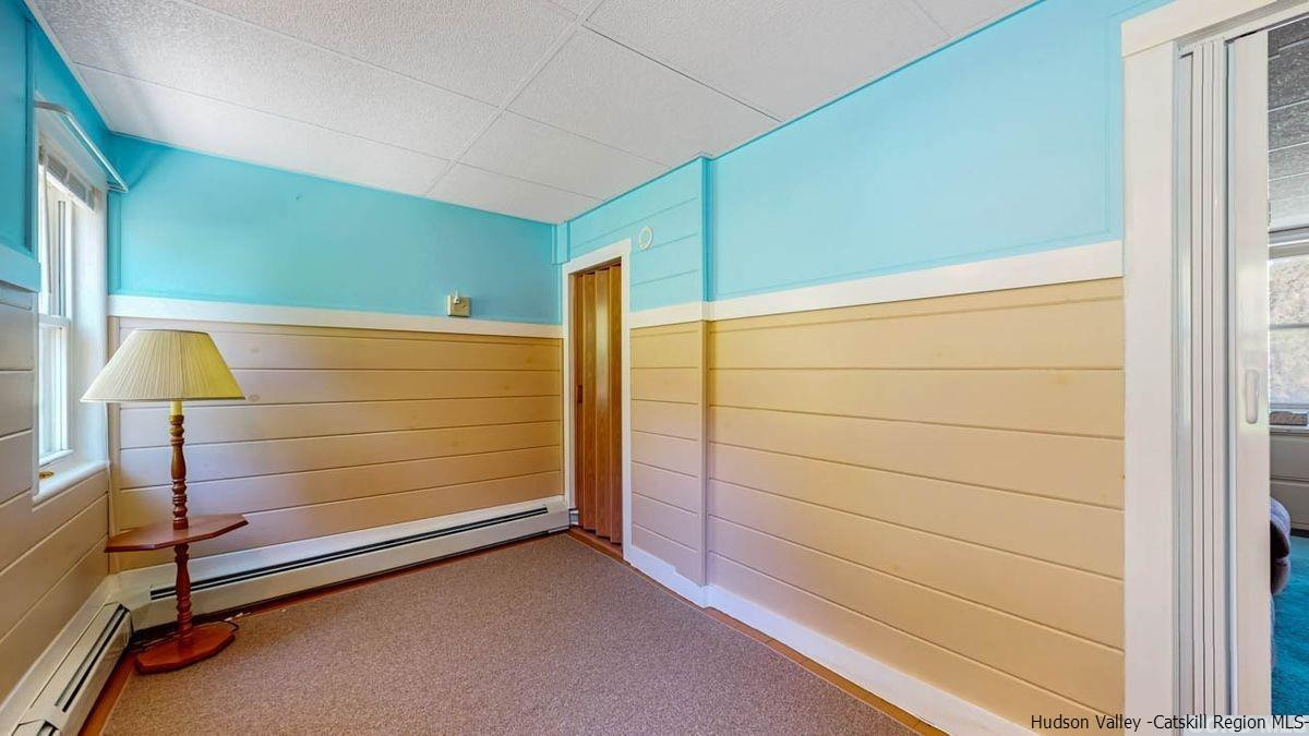 53 Pine Valley Road Greenville, NY 12083 - Photo 31 of 35 a room with a wooden floor and furniture