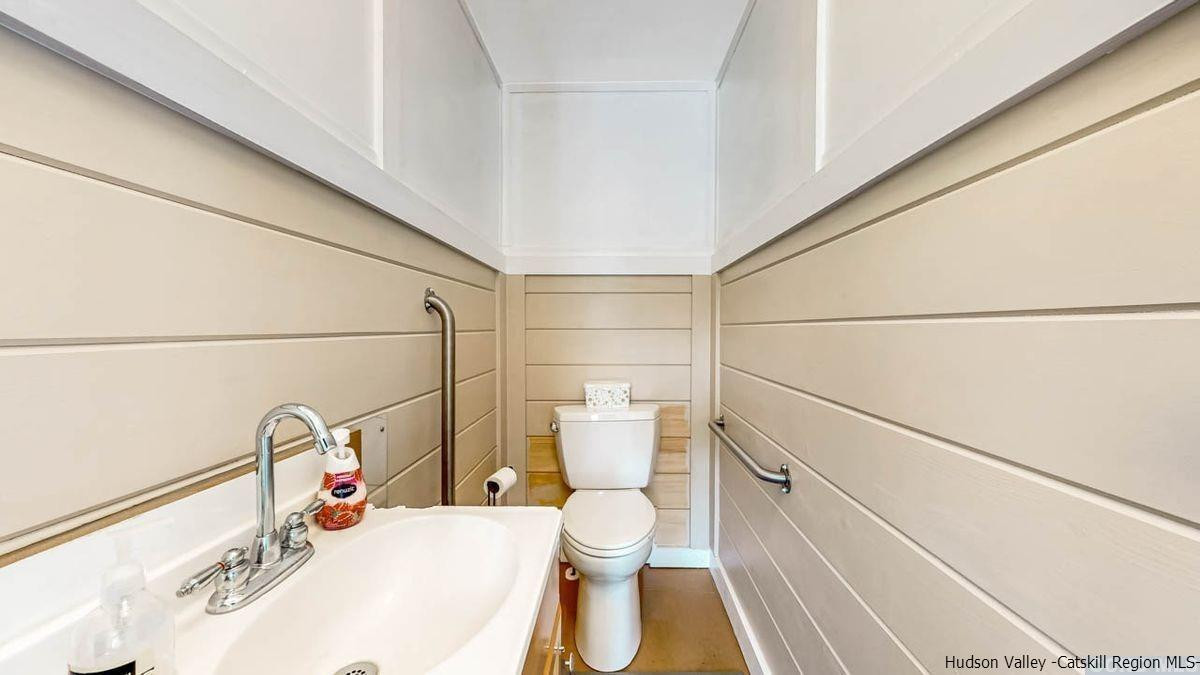 53 Pine Valley Road Greenville, NY 12083 - Photo 34 of 35 a bathroom with a sink mirror vanity and toilet
