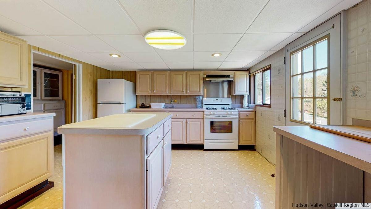 53 Pine Valley Road Greenville, NY 12083 - Photo 7 of 35 a kitchen that has a lot of white cabinets and stainless steel appliances