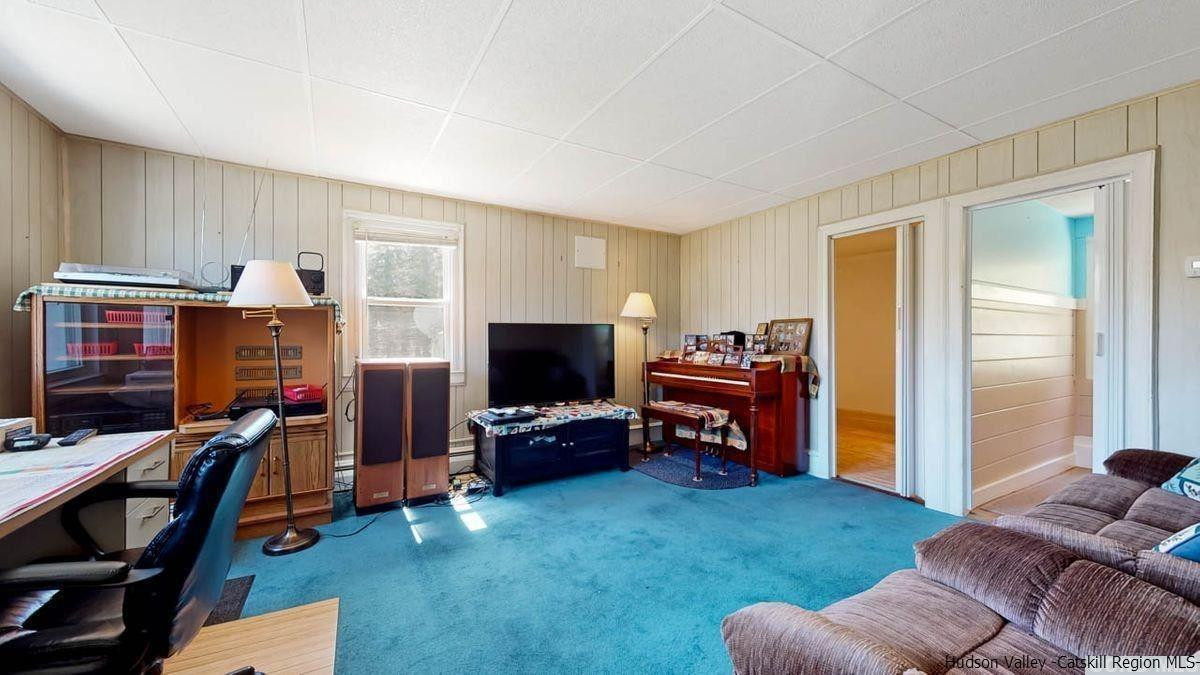 53 Pine Valley Road Greenville, NY 12083 - Photo 10 of 35 a living room with furniture and a flat screen tv