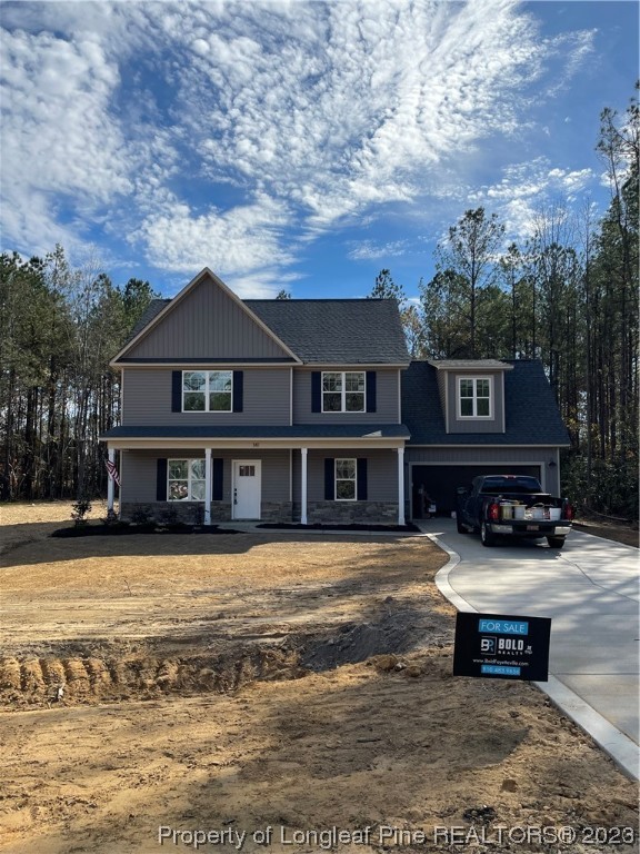 a view of a house with swimming pool and sitting area