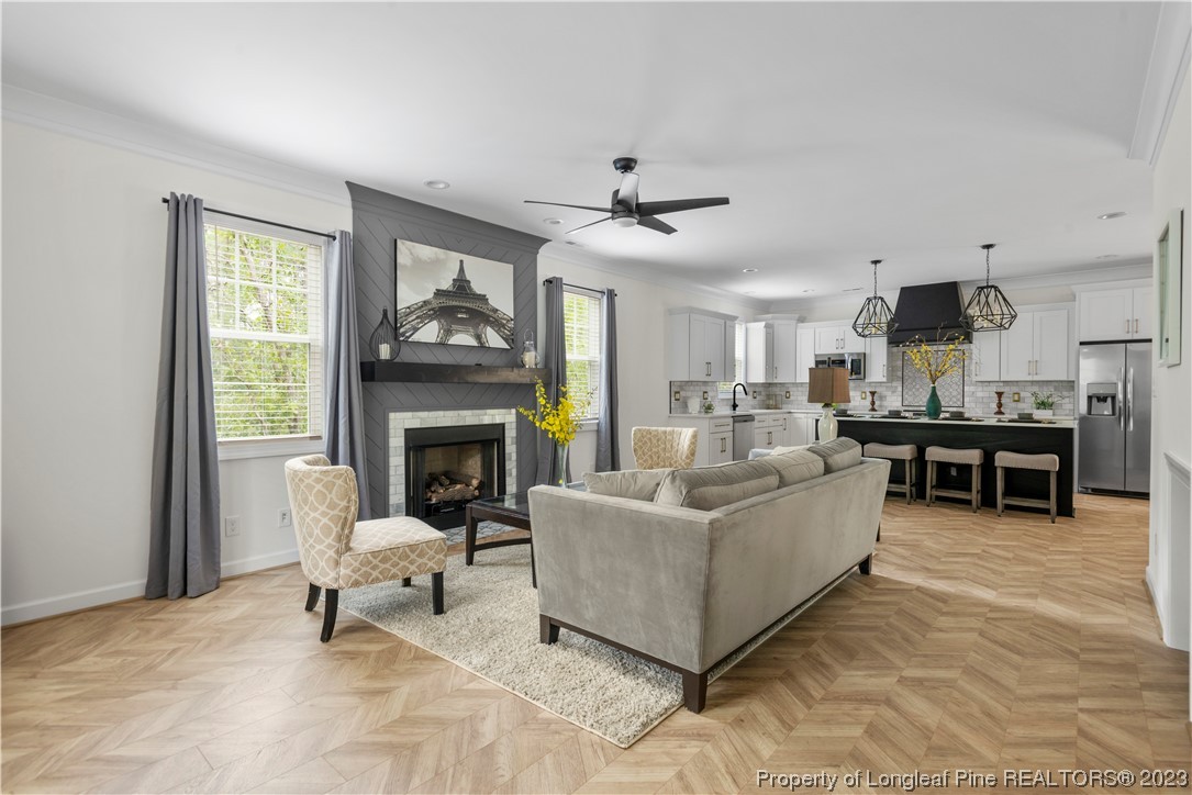 141 Sears Drive Cameron, NC 28326 - Photo 12 of 27 a living room with furniture a fireplace and a window