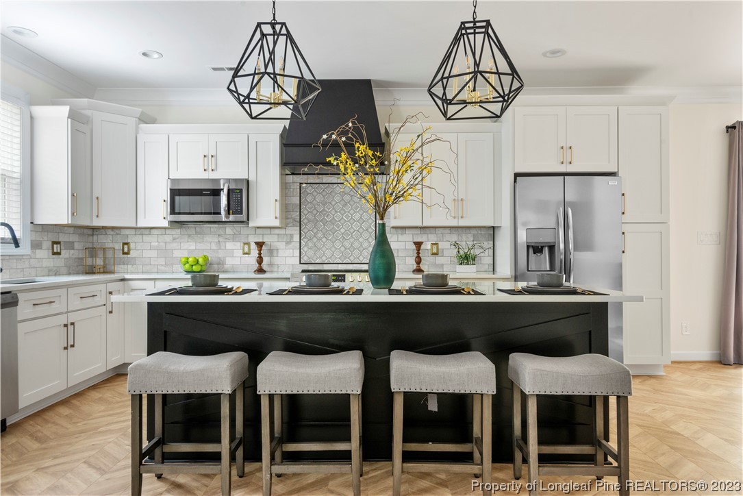 141 Sears Drive Cameron, NC 28326 - Photo 15 of 27 a kitchen with a table and chairs in it