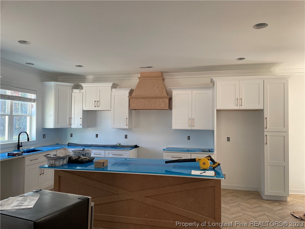 141 Sears Drive Cameron, NC 28326 - Photo 3 of 27 a kitchen with stainless steel appliances granite countertop a sink stove and cabinets