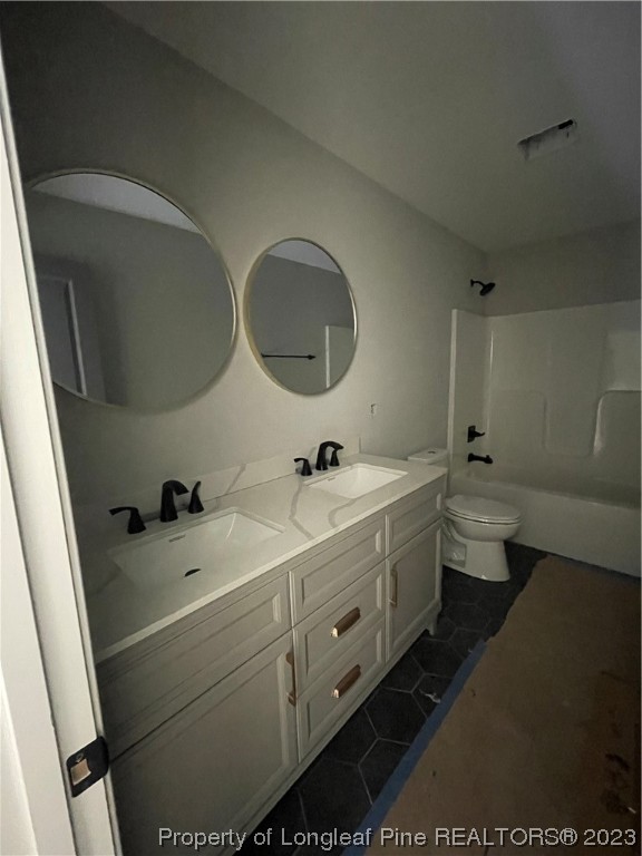 141 Sears Drive Cameron, NC 28326 - Photo 10 of 27 a bathroom with a double vanity sink and mirror with toilet