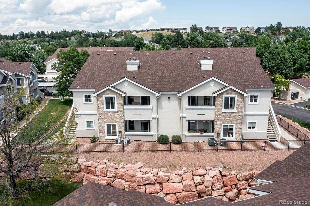 3875 Strawberry Field Grove Colorado Springs, CO 80906 - Photo 15 of 50 a view of house with yard