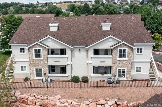 a aerial view of a house with yard